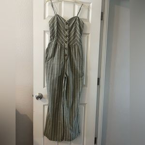 Super cute jumpsuit! Worn one time on vacation. Size Large fits a size 8